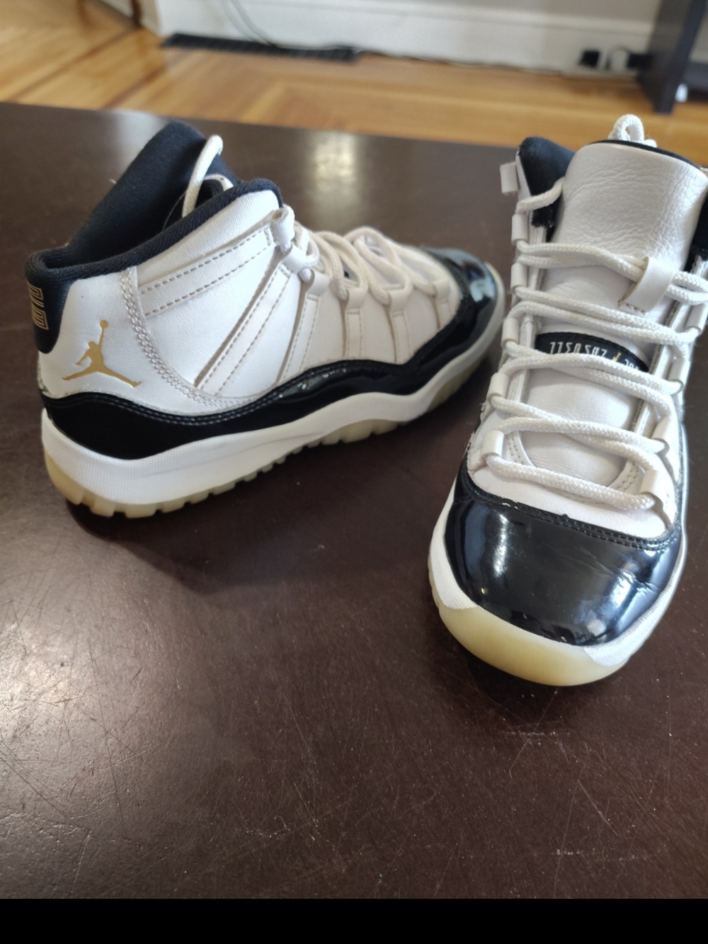 Kids Jordan 11 White and Black Basketball Shoes with Gold Jumpman